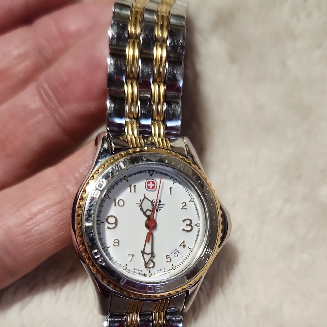 Silver And Gold Wristwatch With White Dial
